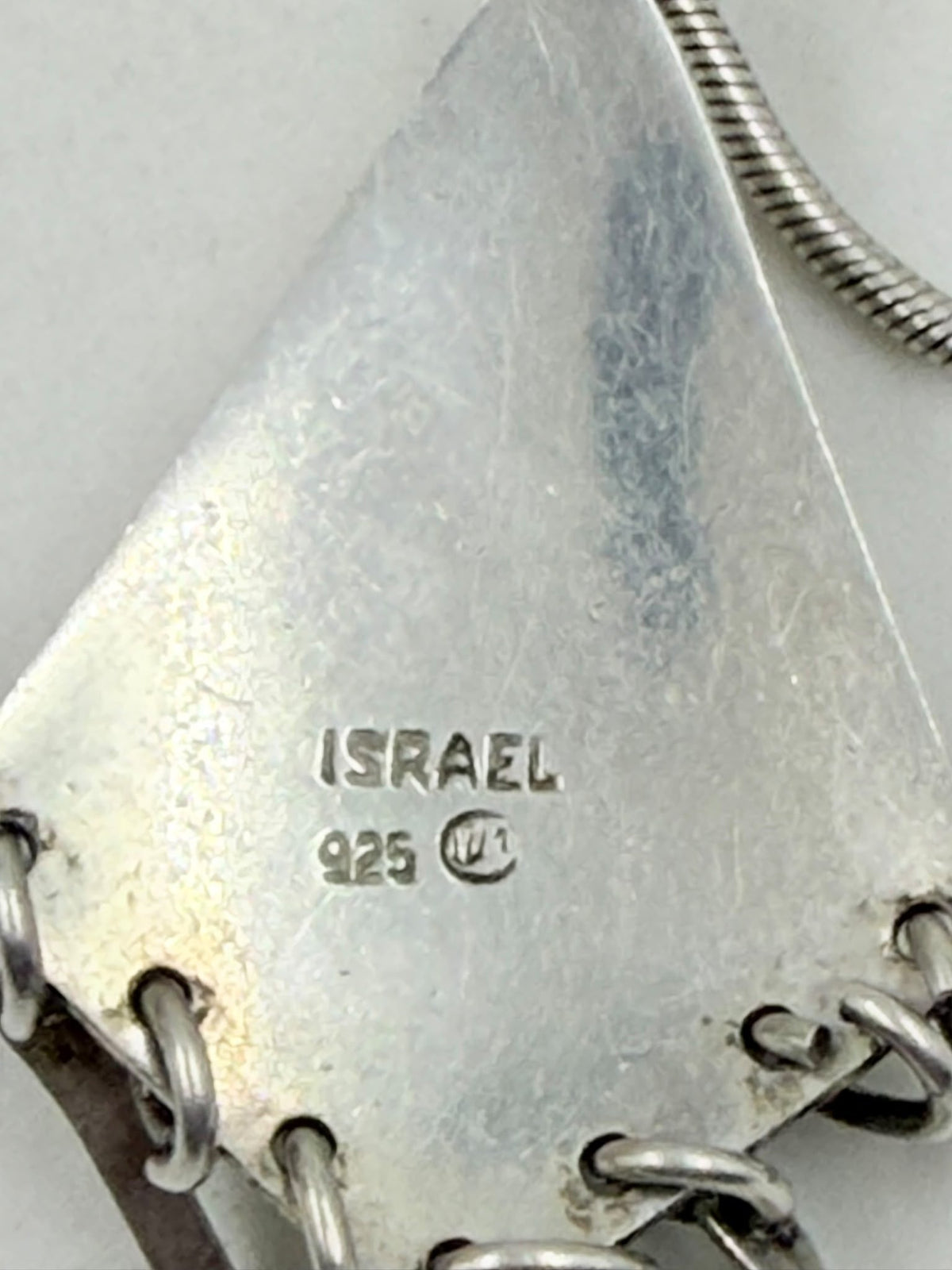 Silver tribal pendant with dangling bars detail