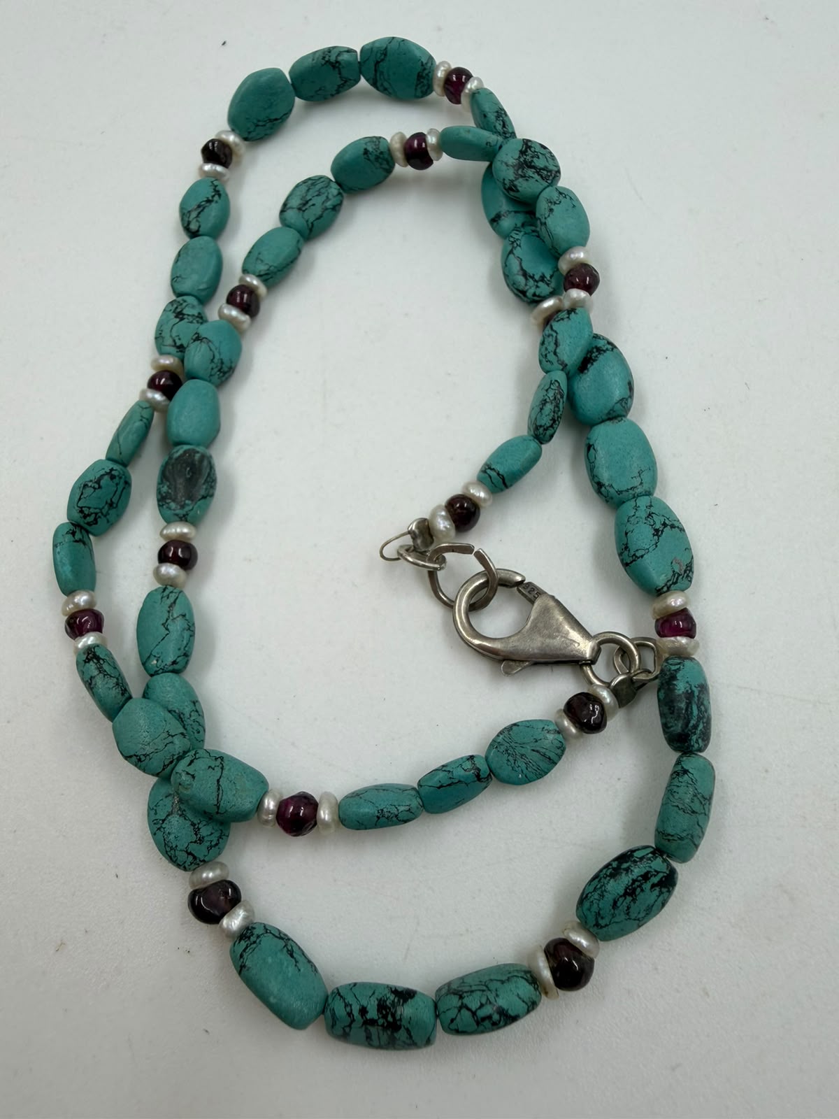 925 sterling silver lobster clasp hallmark close-up on turquoise necklace