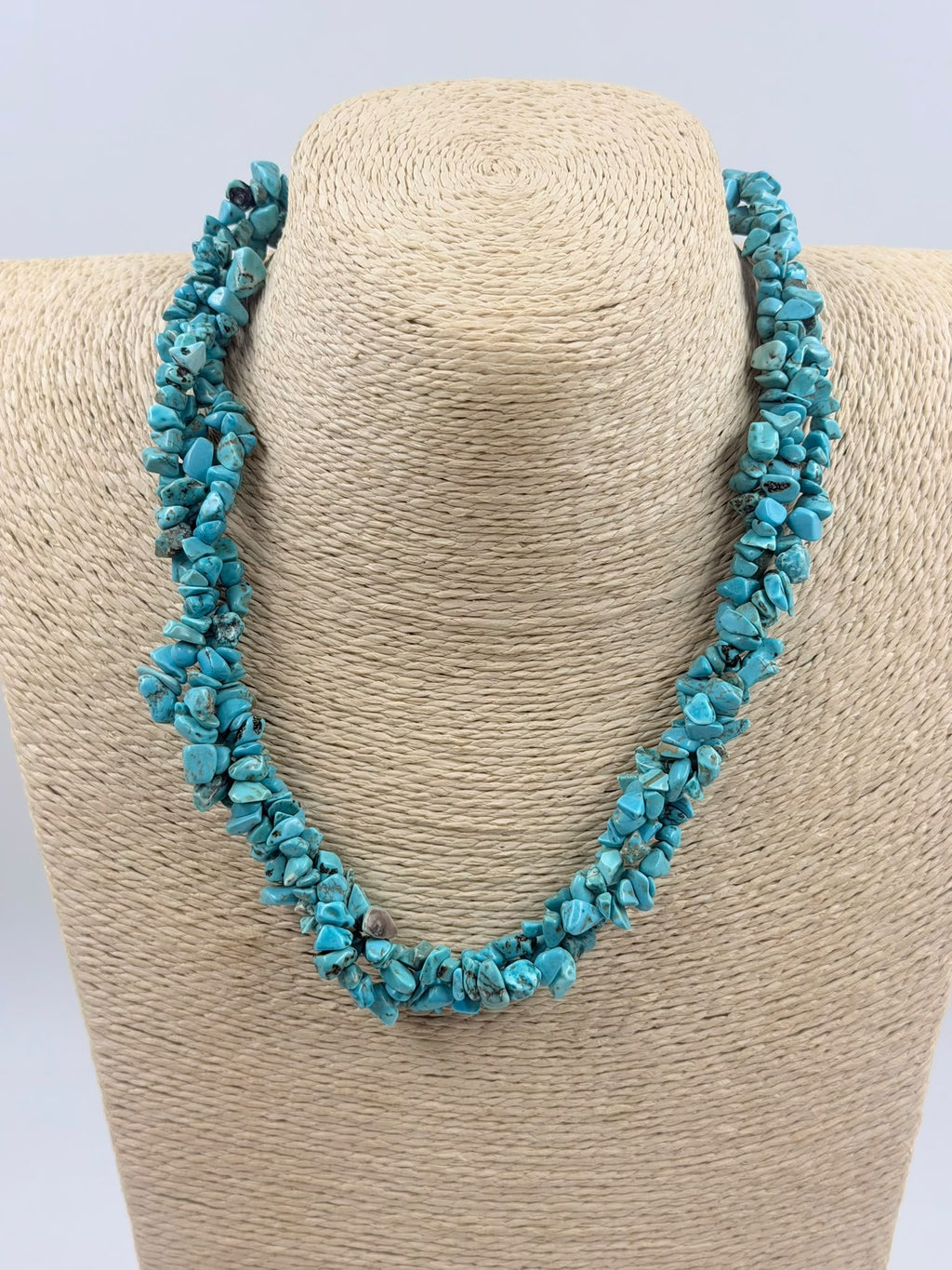 Close-up of turquoise chip stones showing natural matrix pattern