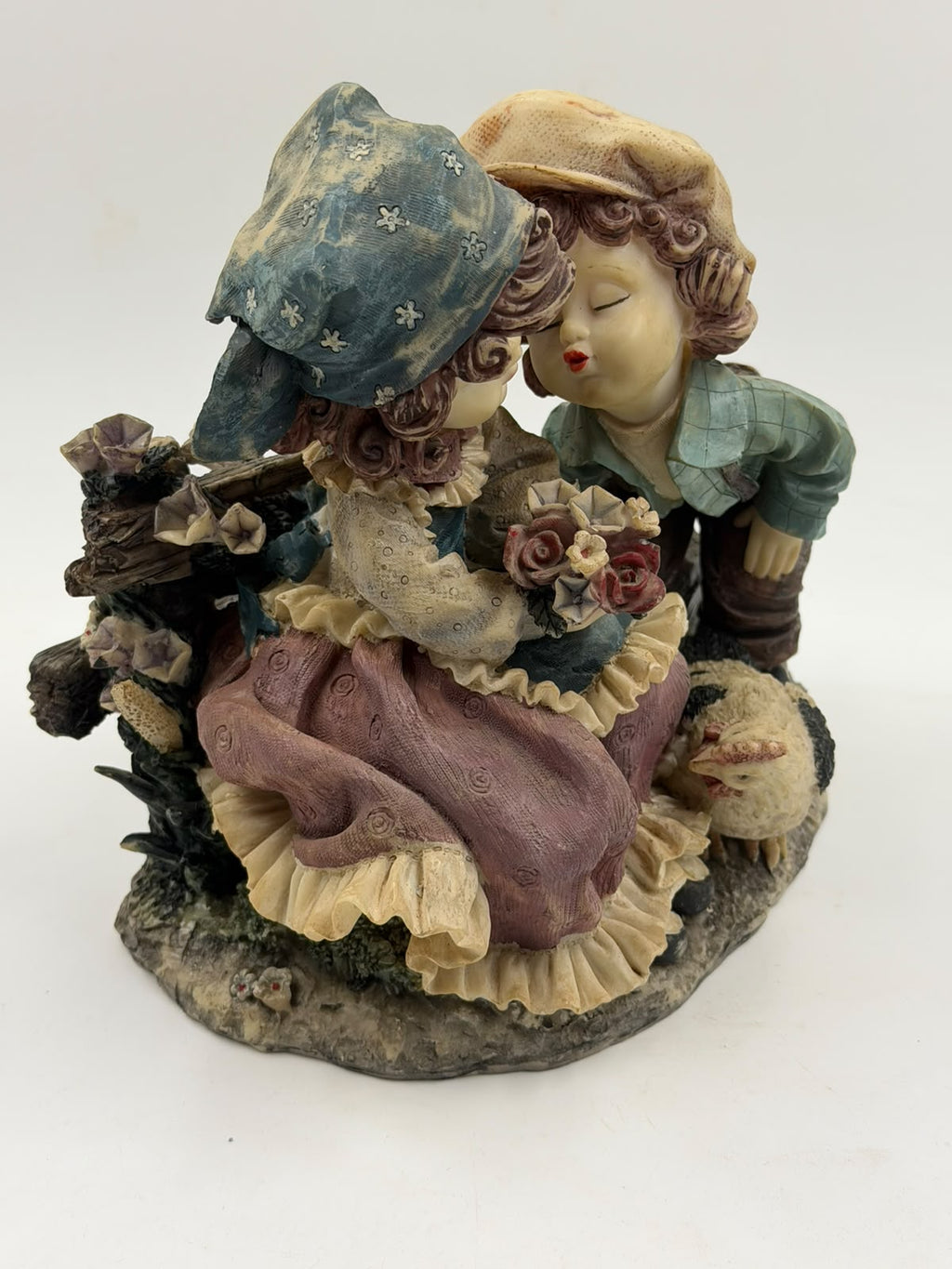 Vintage Victorian resin couple figurine with ruler showing 21cm height