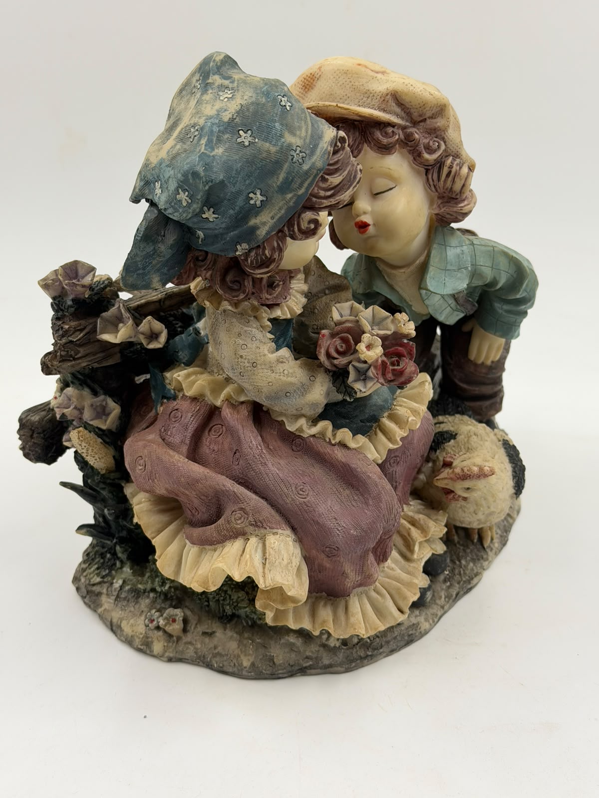 Vintage Victorian resin couple figurine with ruler showing 21cm height