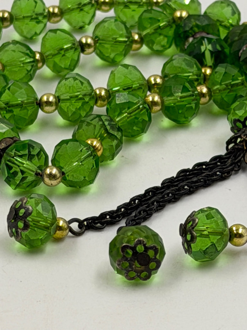 Green crystal misbaha - close-up of beads and tassel