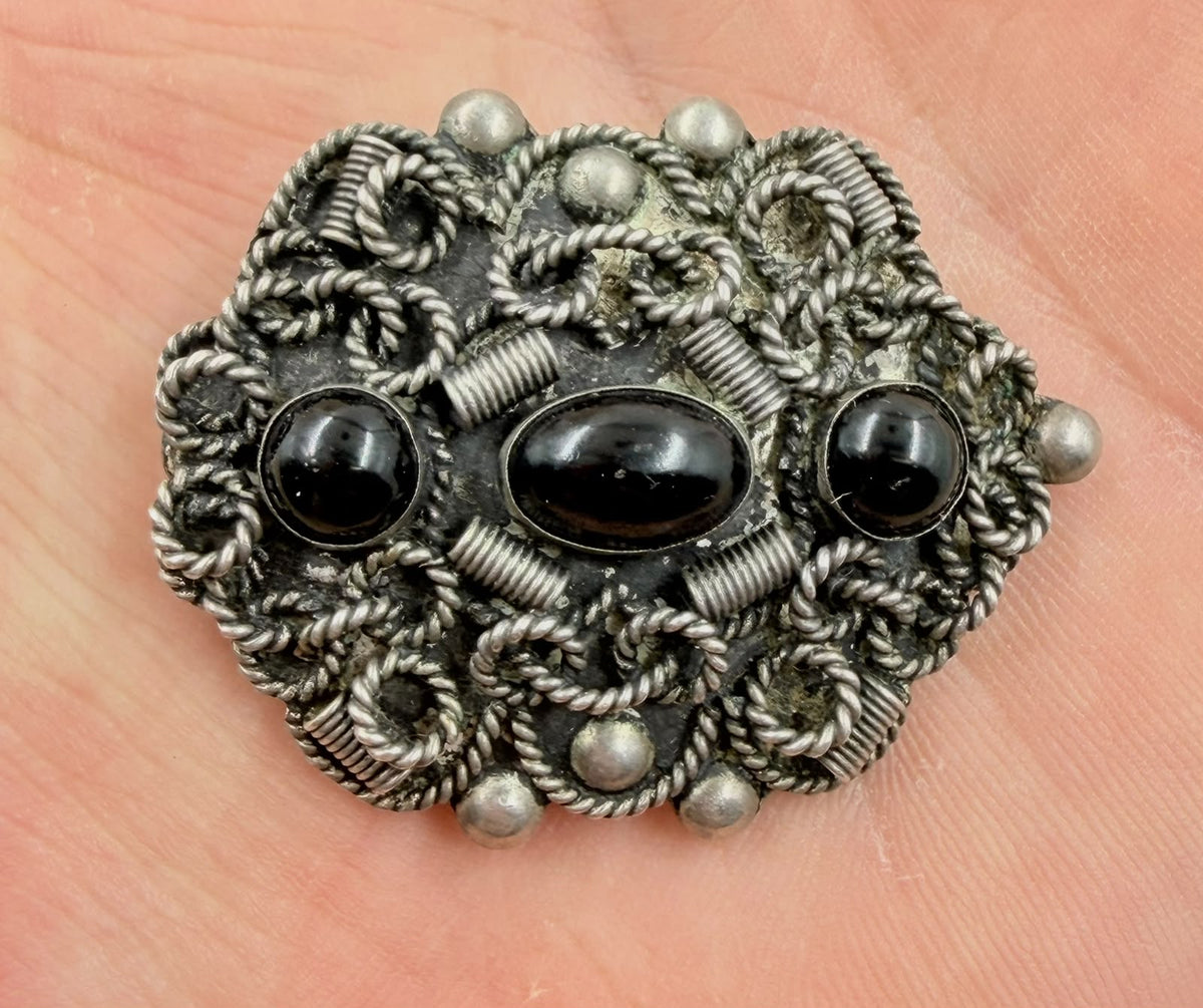 Back of set showing .925 silver hallmarks on earrings, brooch and bracelet