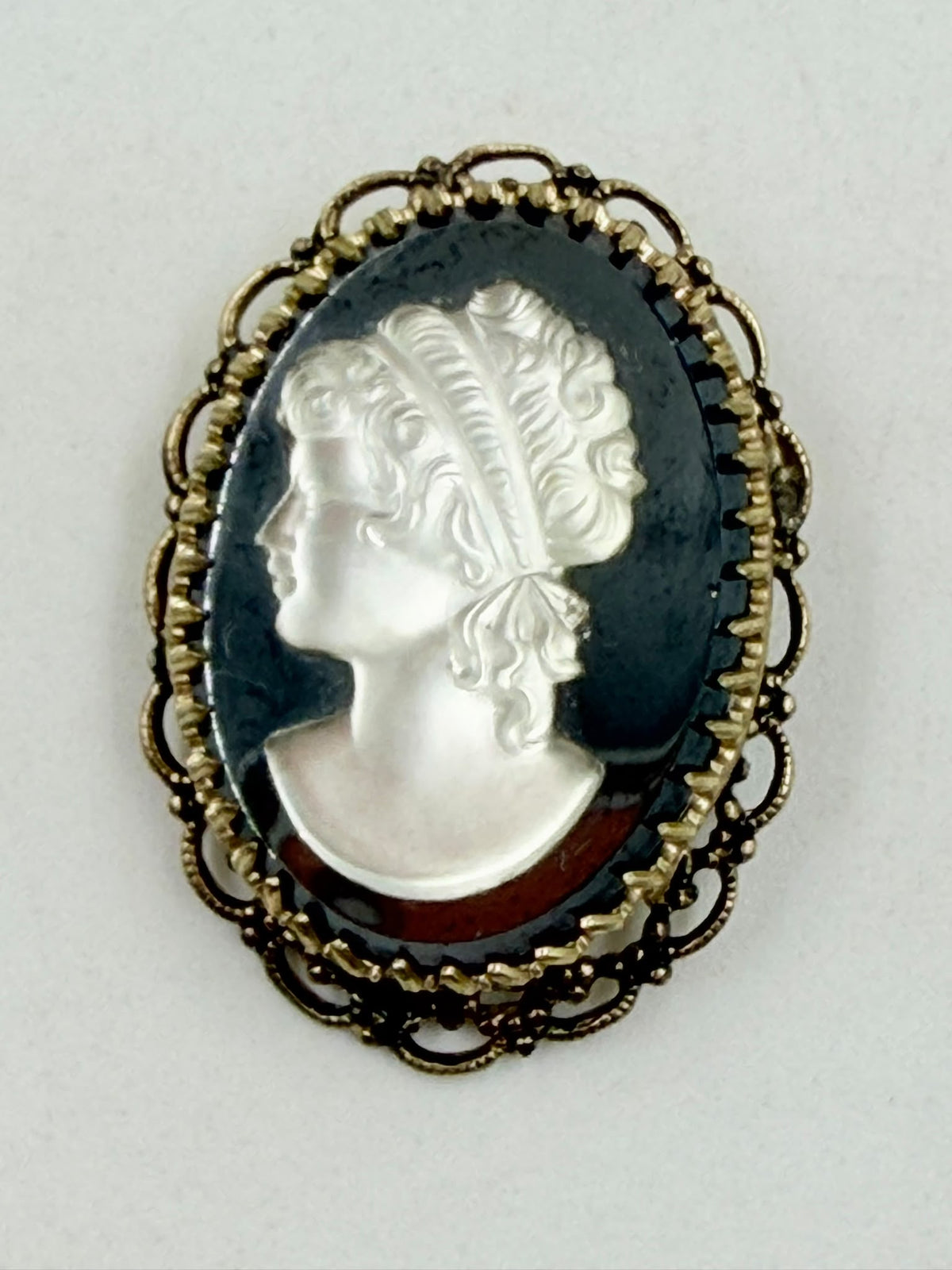 Vintage cameo brooch front view on flat surface
