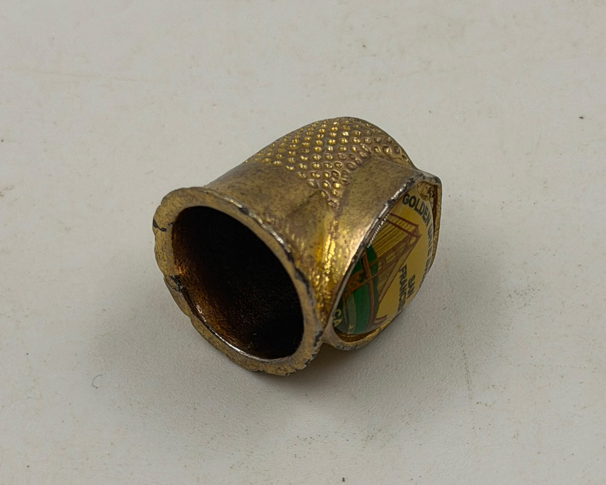 Vintage FORT USA gold thimble – closed display box top view