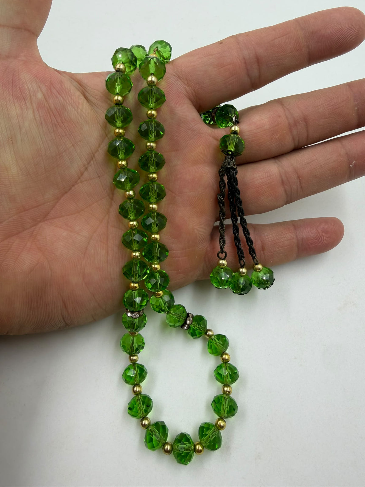 Green crystal misbaha - held in hand