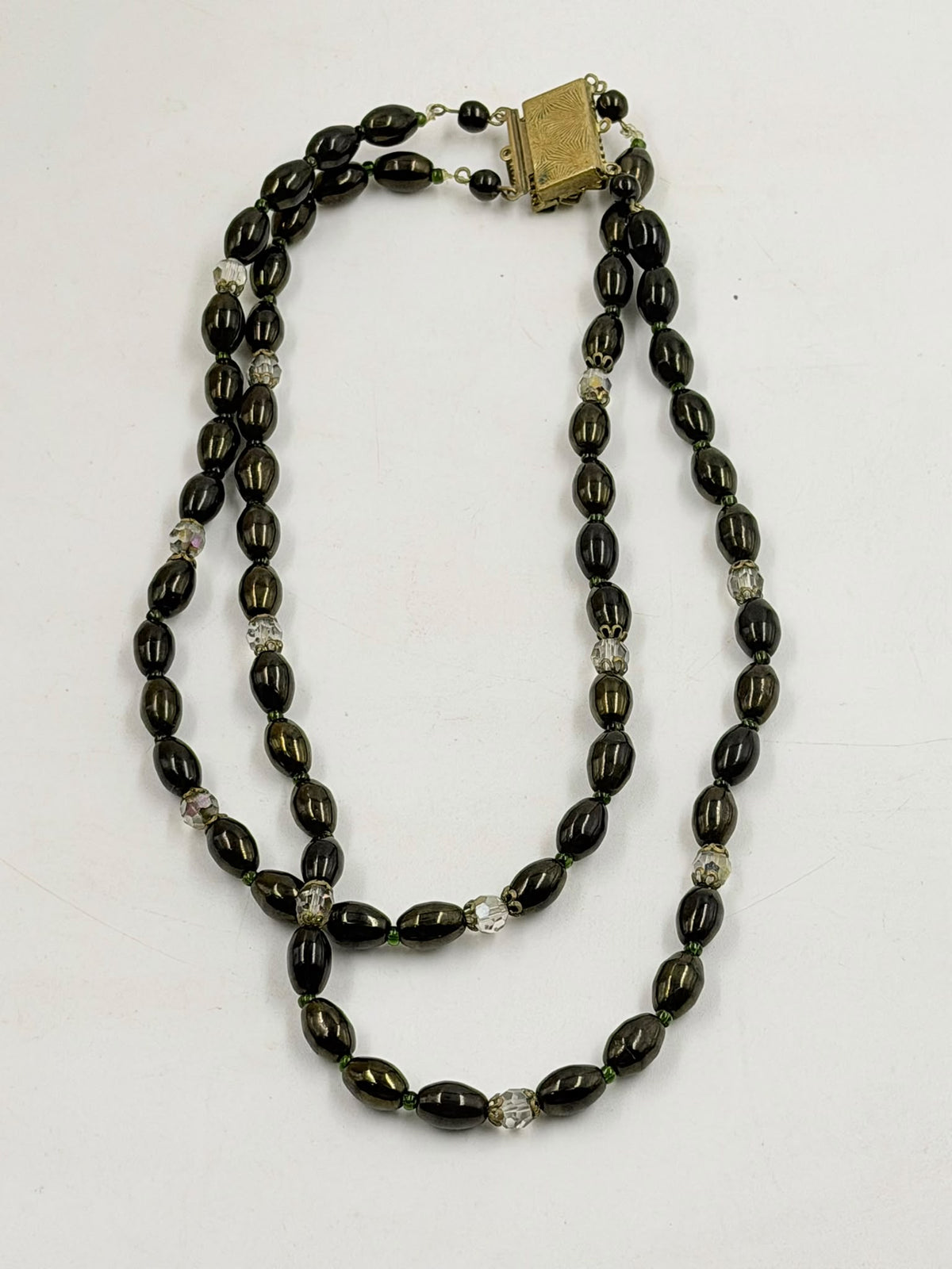 Vintage double strand black beaded necklace on mannequin