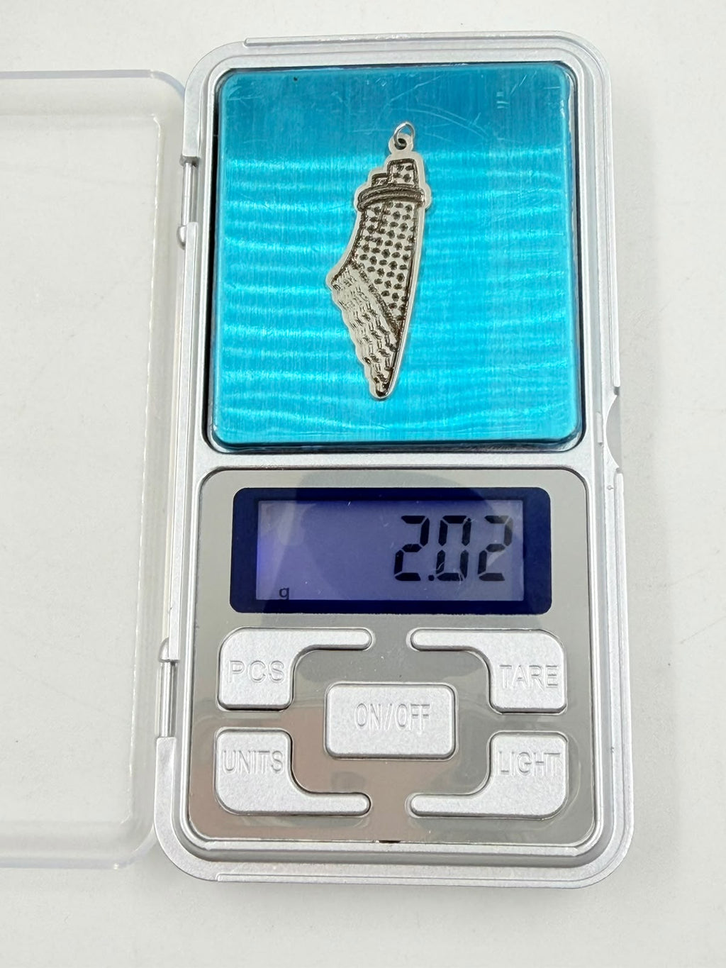 Pendant next to ruler showing 40mm length