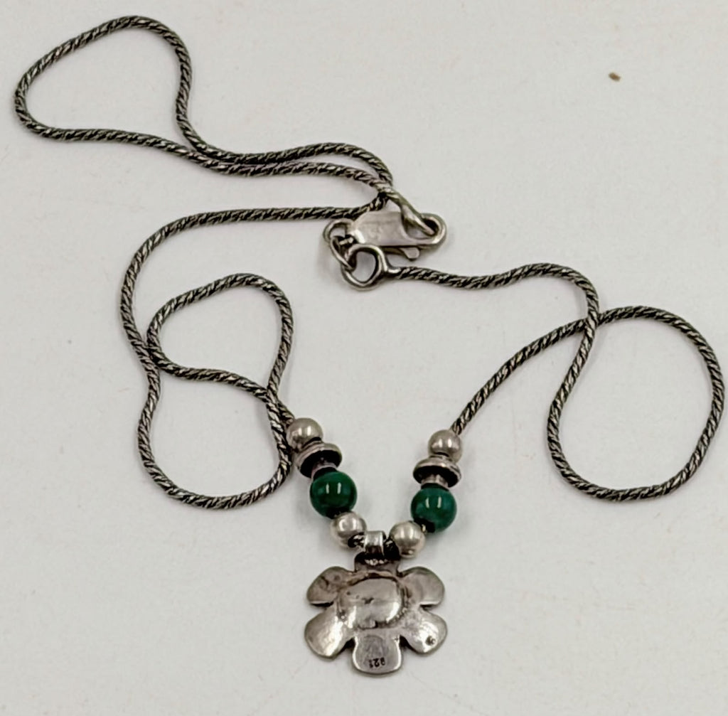 Back of flower pendant showing 925 hallmark