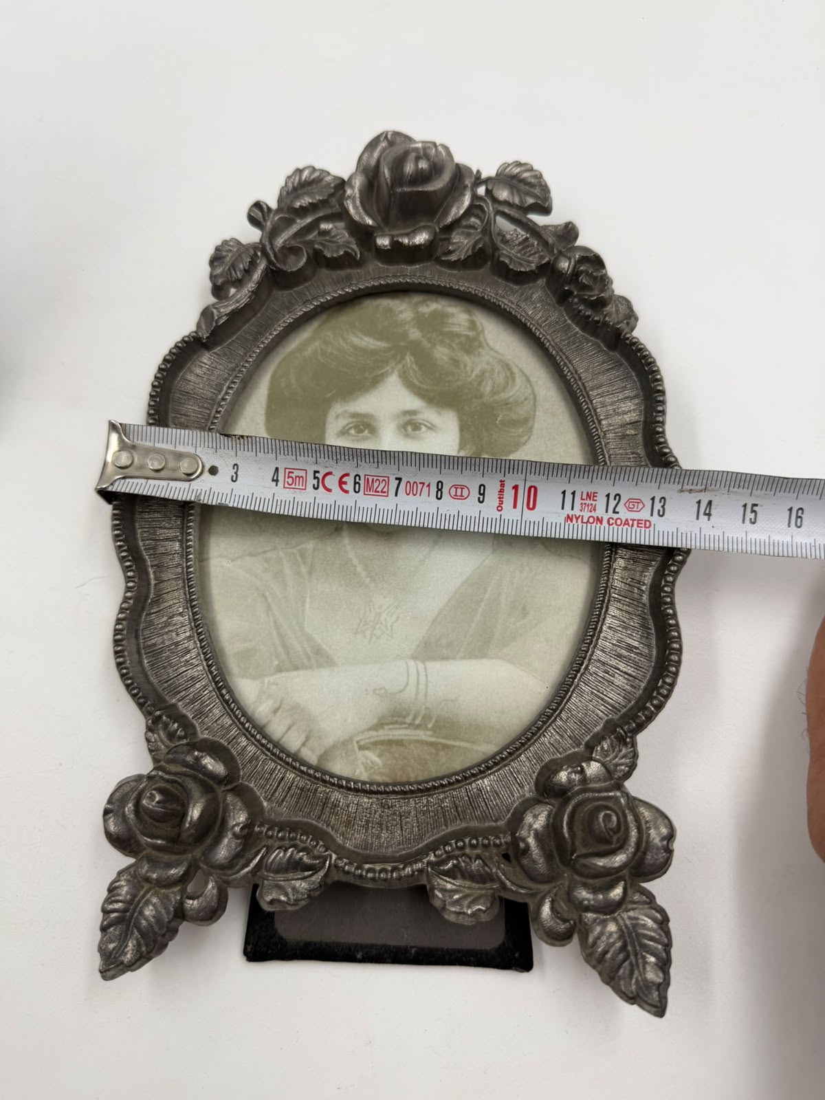 Pewter photo frame decorative feet detail