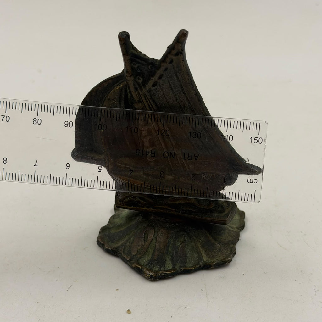 Antique brass sailboat figurine – side detail view