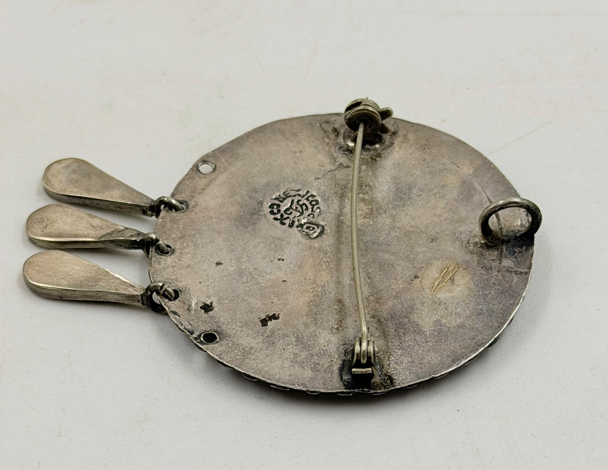 Brooch on flat surface