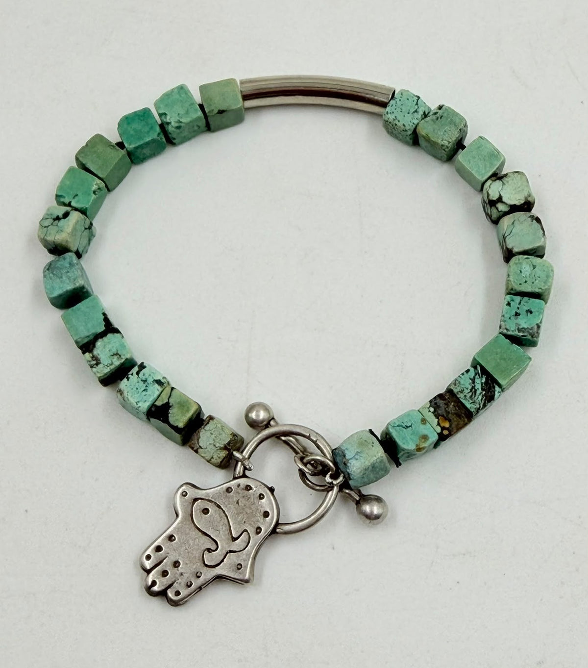 Turquoise bracelet Hamsa charm close up