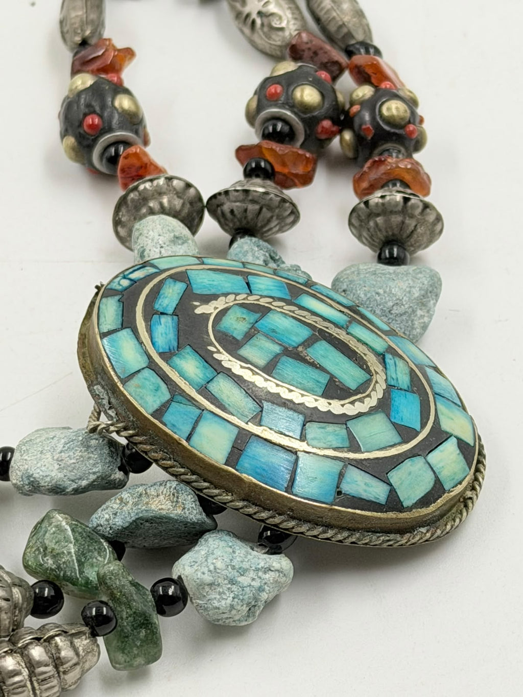 Mixed natural stone beads and mosaic medallion detail