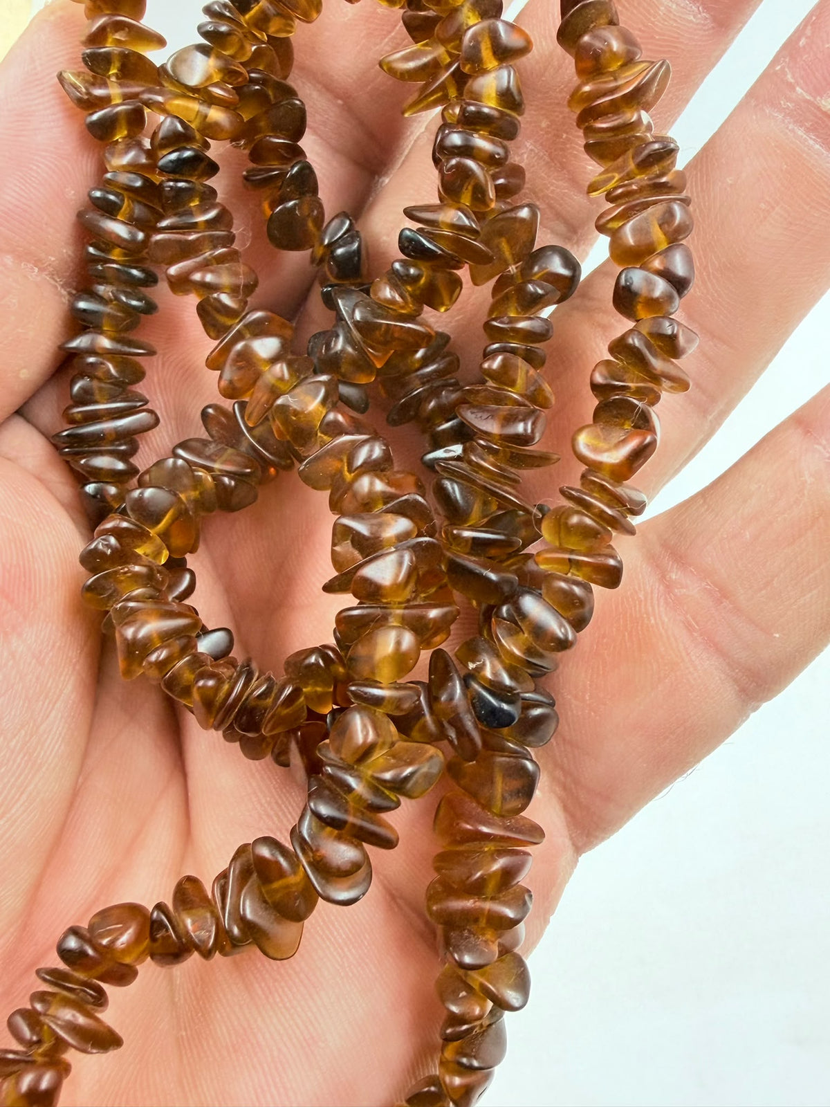 Natural brown agate chip necklace on wicker jewelry bust - full double strand front view