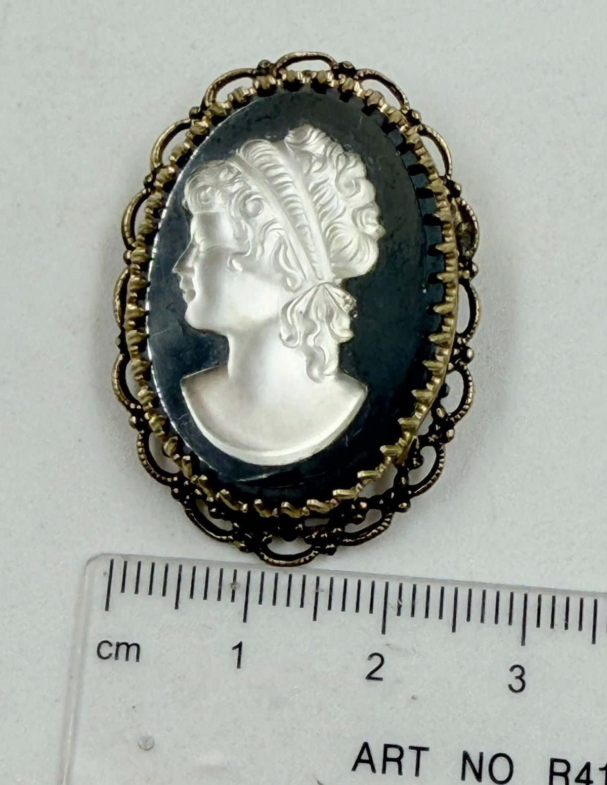 Back of brooch showing filigree and pin mechanism