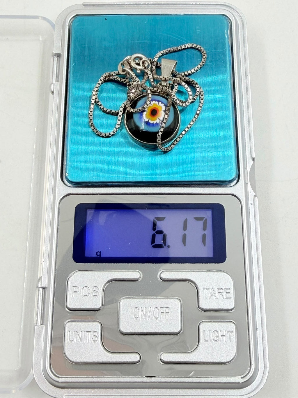 Necklace weight 6.17 grams on digital scale