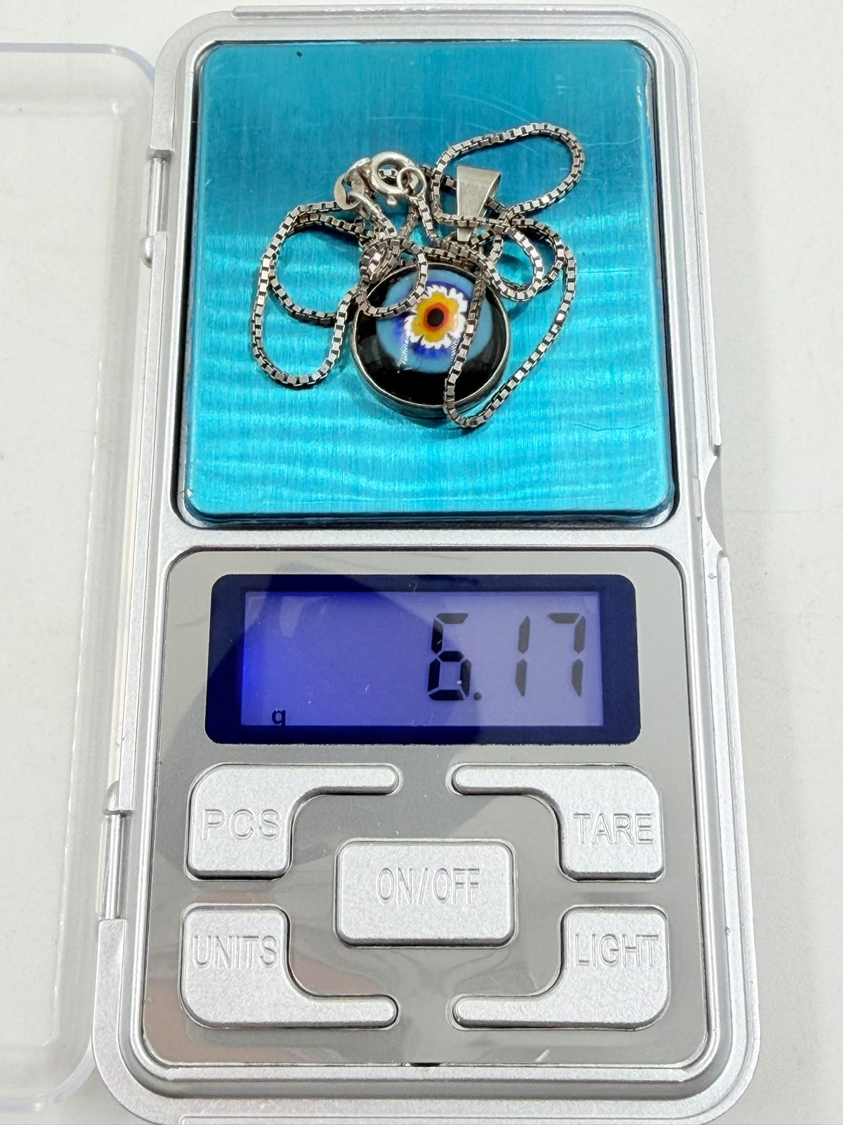 Necklace weight 6.17 grams on digital scale