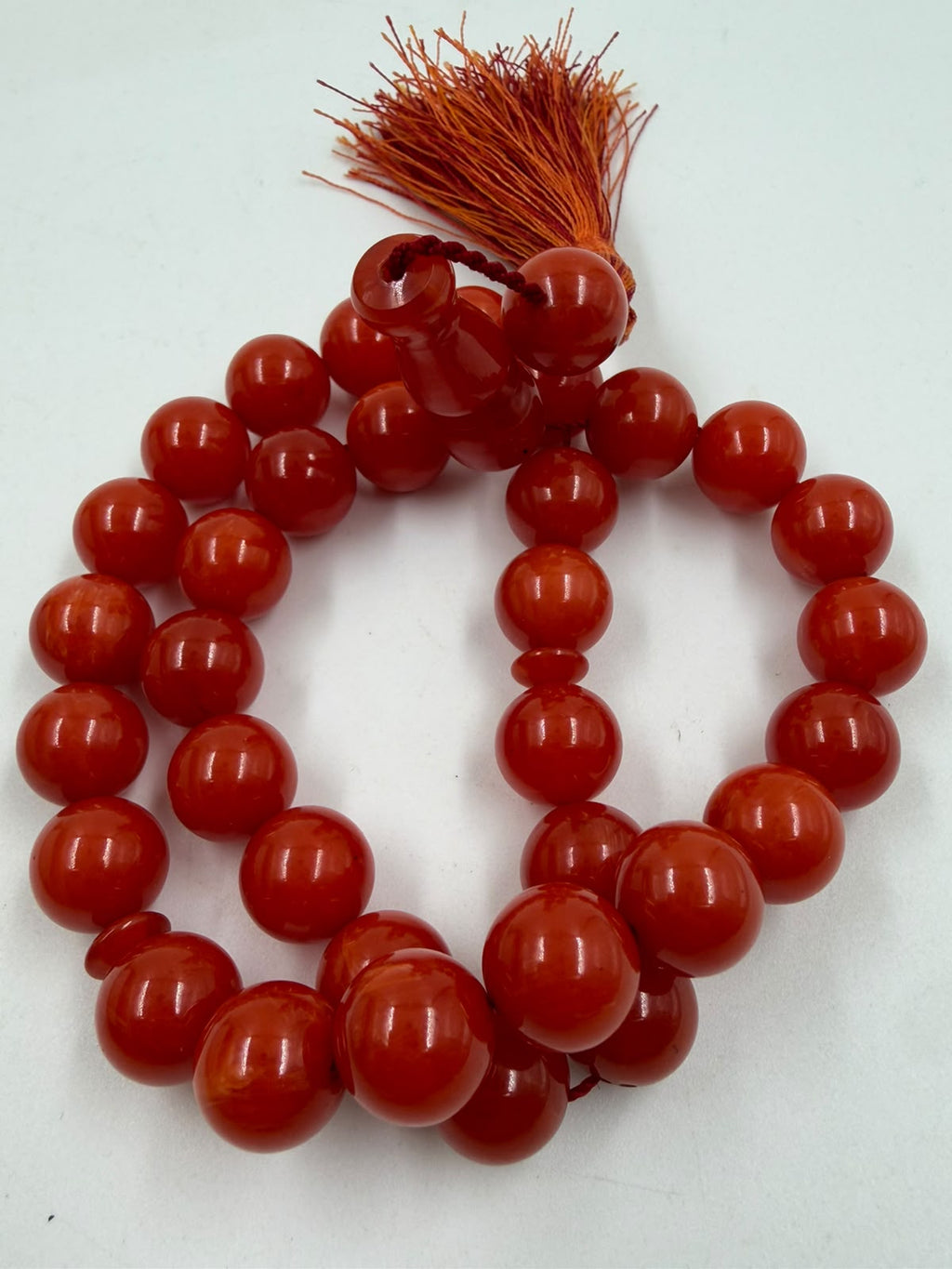 Turkish Faturan prayer beads close-up showing round 12mm polished beads and tassel detail