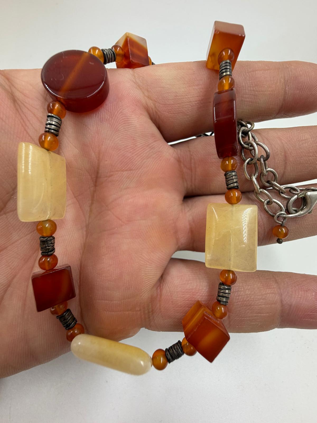 Necklace in palm showing clasp and chain
