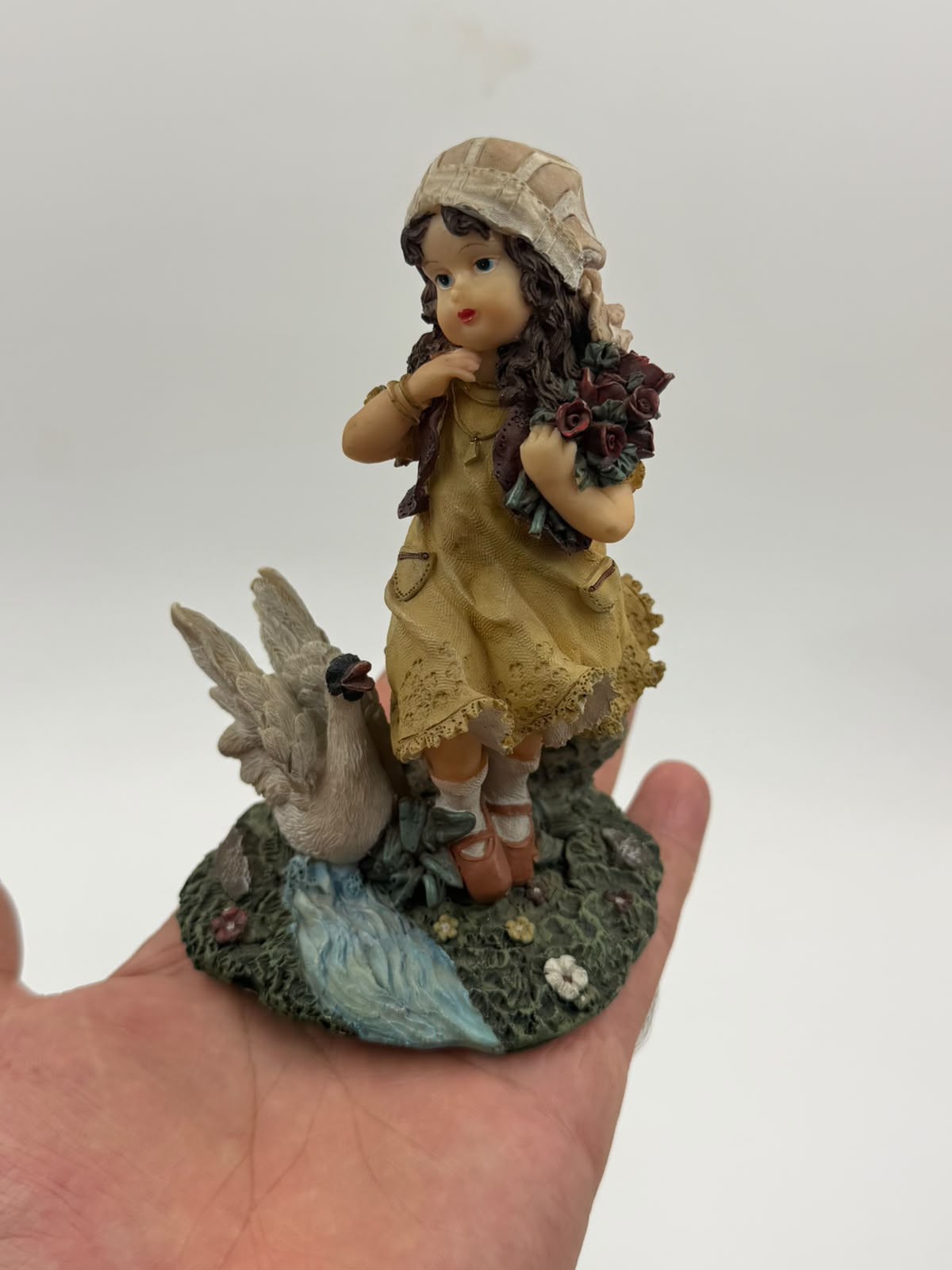 Vintage resin girl with goose figurine – front view with ruler showing 12cm height