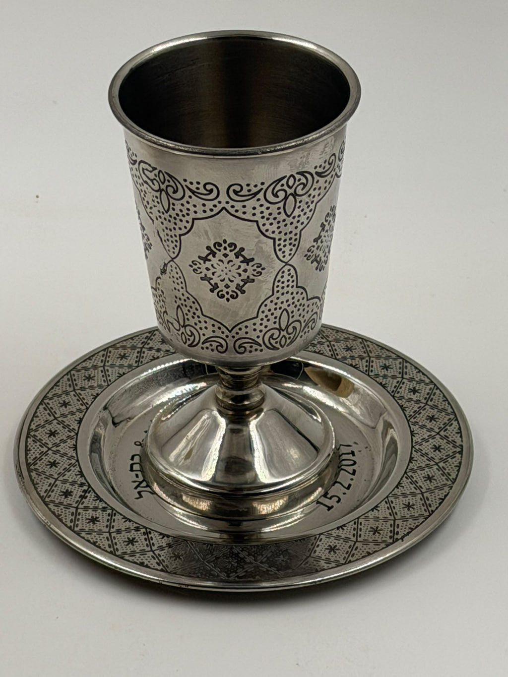 Israeli silver-plated Kiddush cup and saucer set showing Hebrew inscription and date 15.2.2017 on saucer