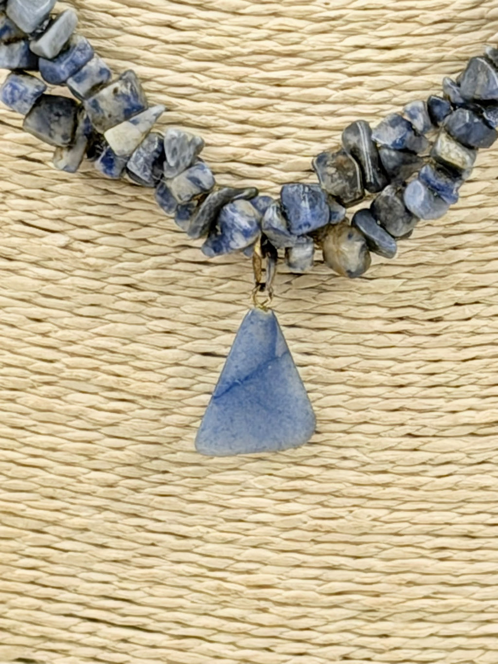 Natural sodalite chip necklace on wicker bust - close view showing pendant and clasp detail