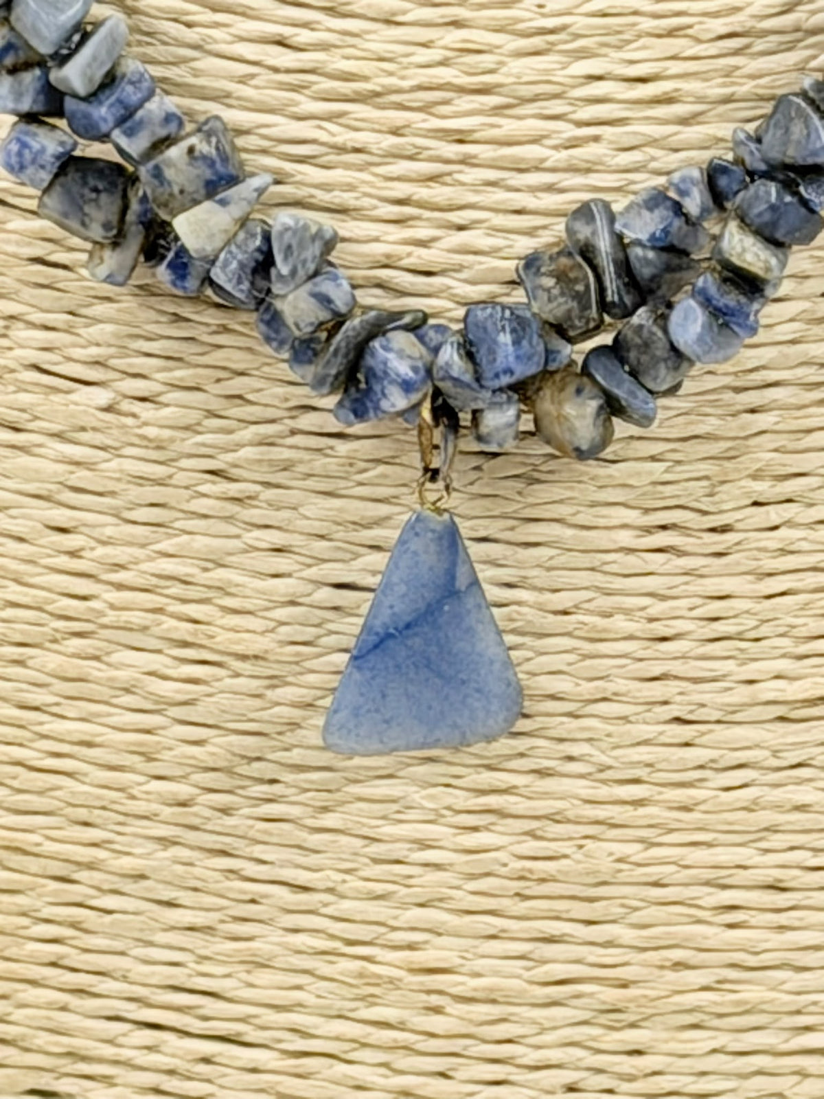 Natural sodalite chip necklace on wicker bust - close view showing pendant and clasp detail