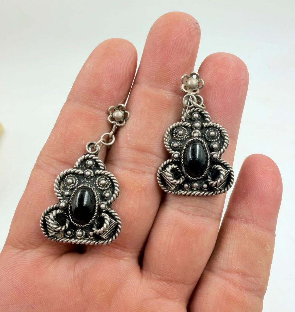 Wide silver filigree bracelet with black onyx beads - front view