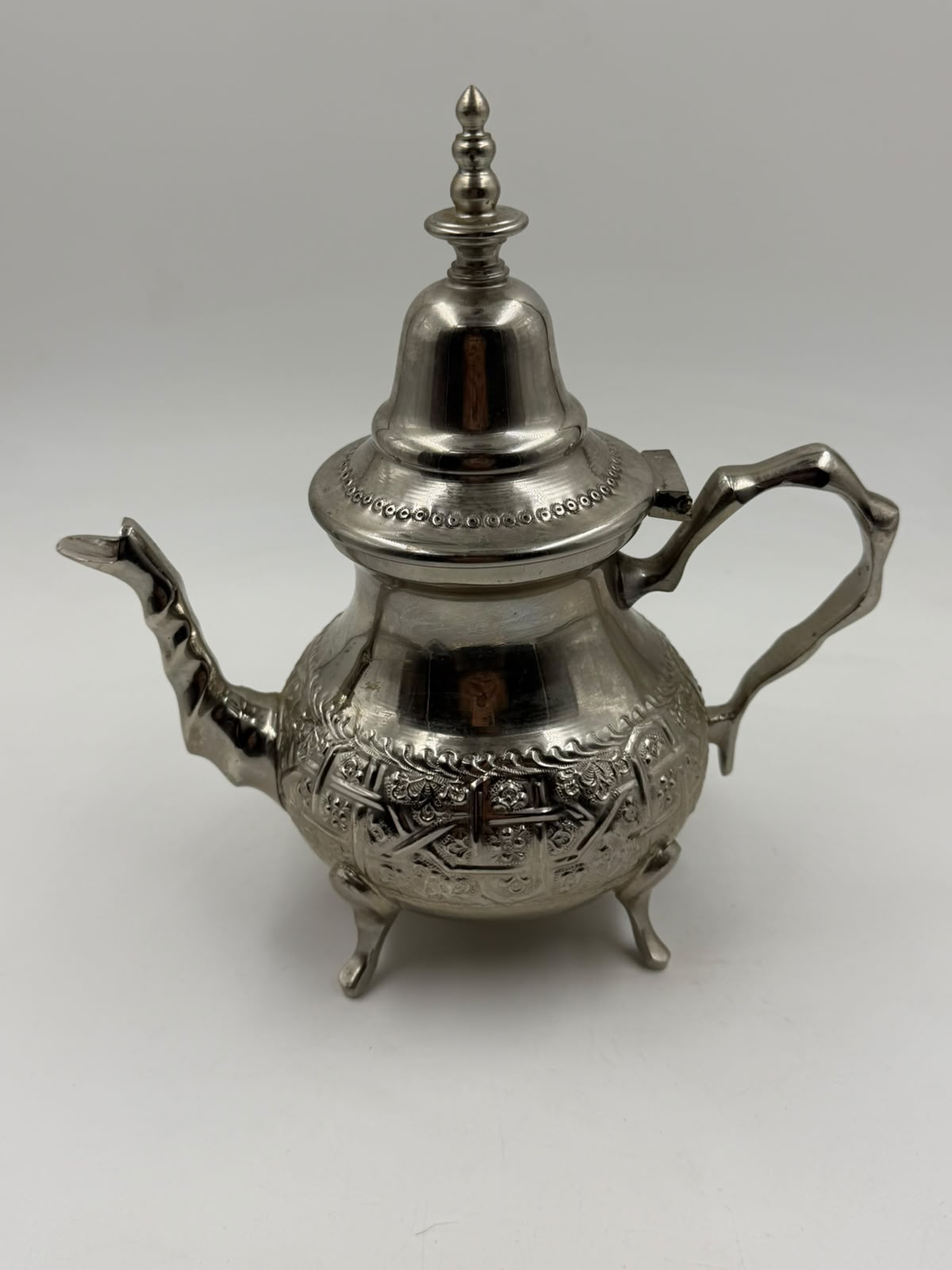 Vintage Moroccan Silver-Plated Teapot held in hand showing size