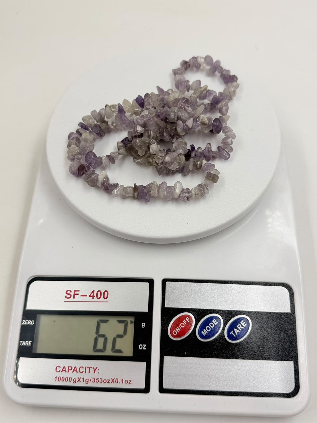 Natural amethyst chip necklace weight 62 grams on digital scale