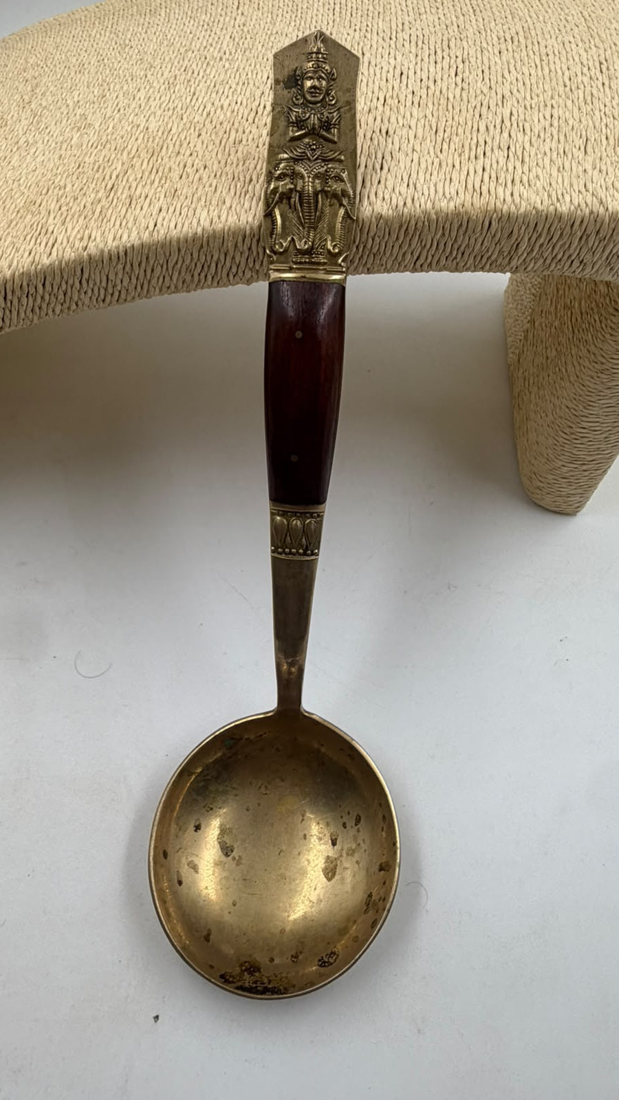 Antique Thai brass ladle – side angle view