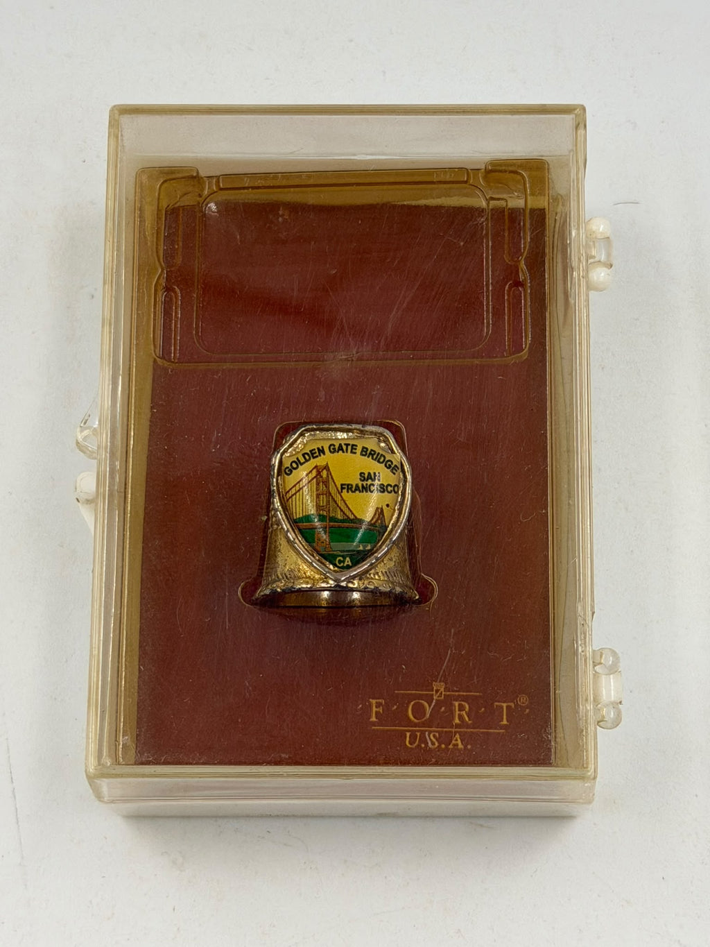 Vintage FORT USA gold thimble – held in hand showing scale