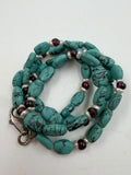 Natural turquoise nugget garnet pearl necklace coiled view showing 925 silver lobster clasp