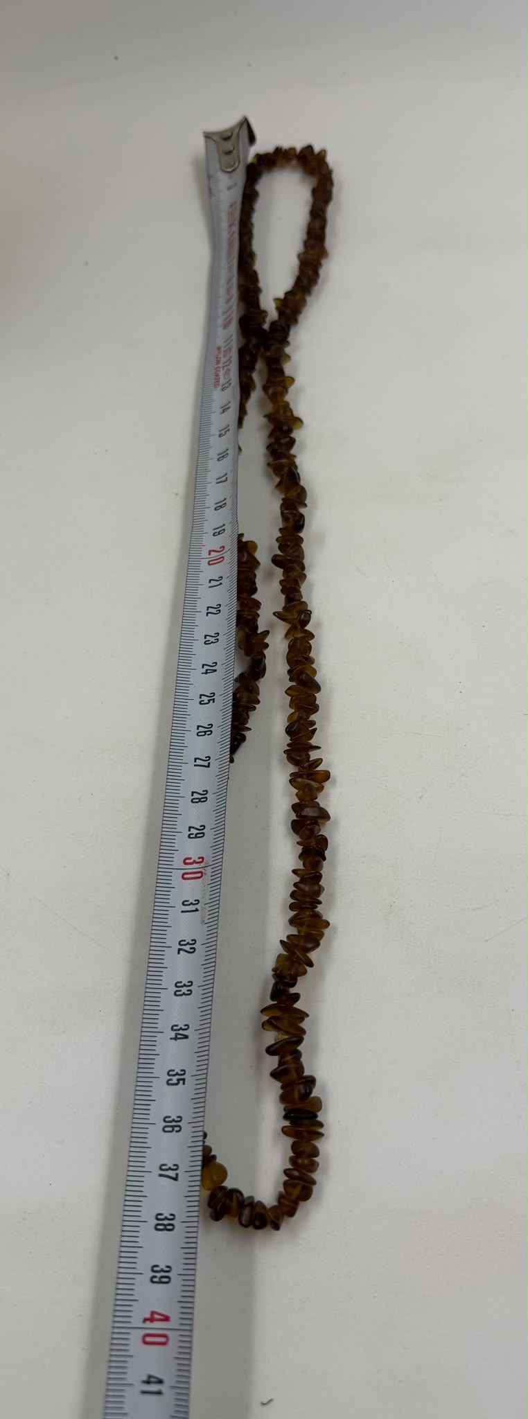 Natural brown agate chip necklace on wicker bust - single strand long view