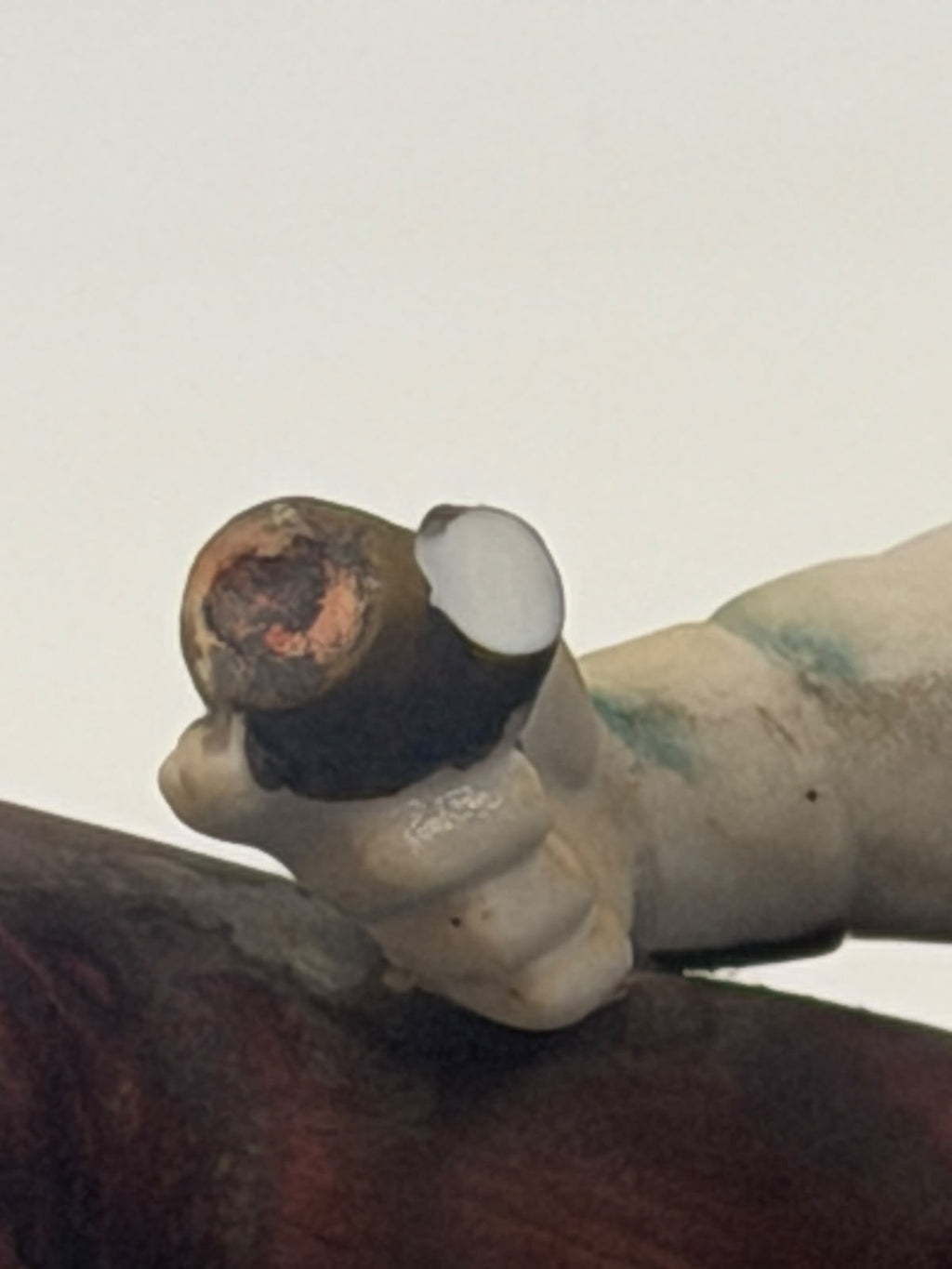 Vintage Capodimonte flute player figurine close-up of face and flute detail