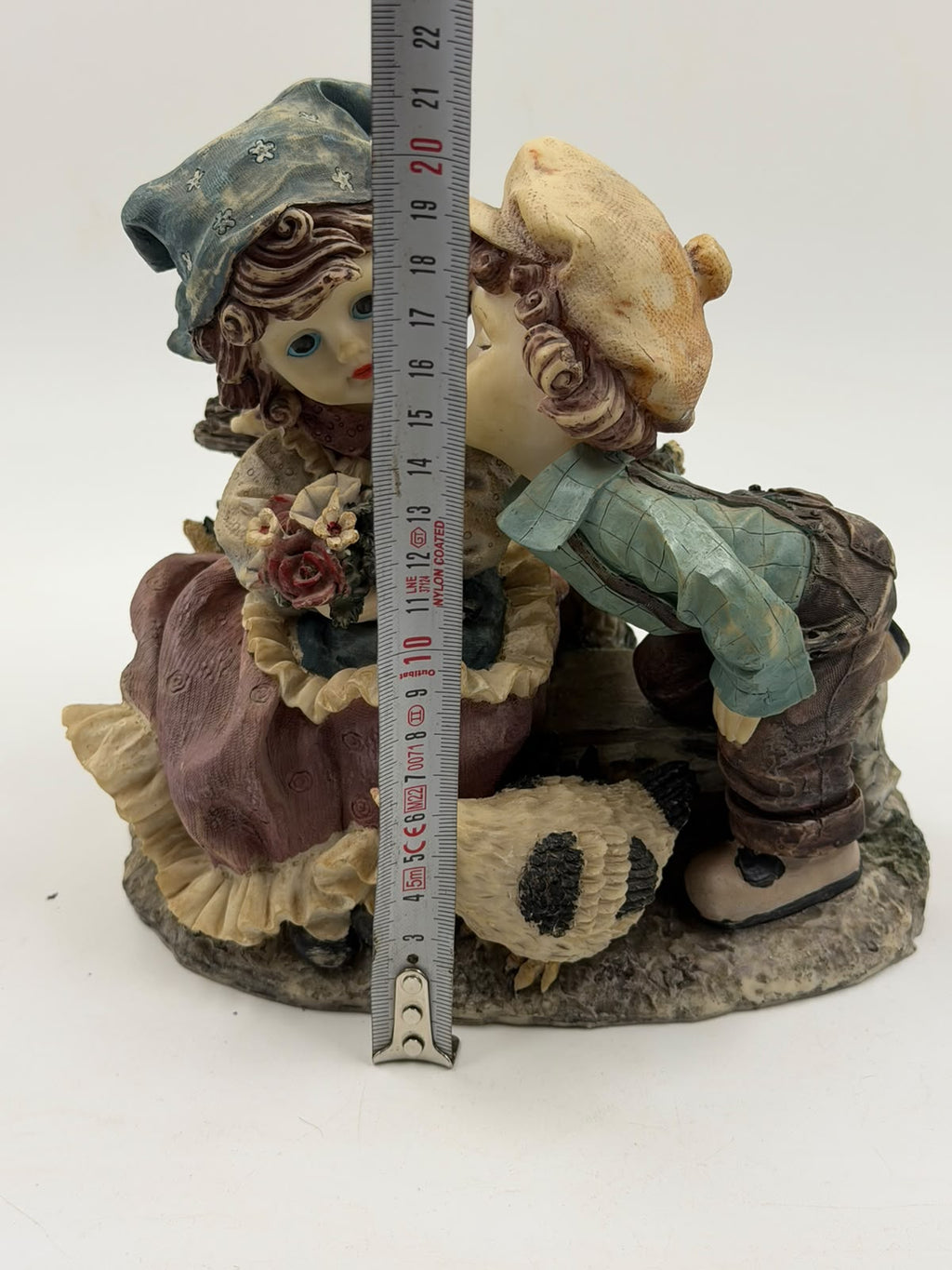 Vintage Victorian resin couple figurine close-up front detail