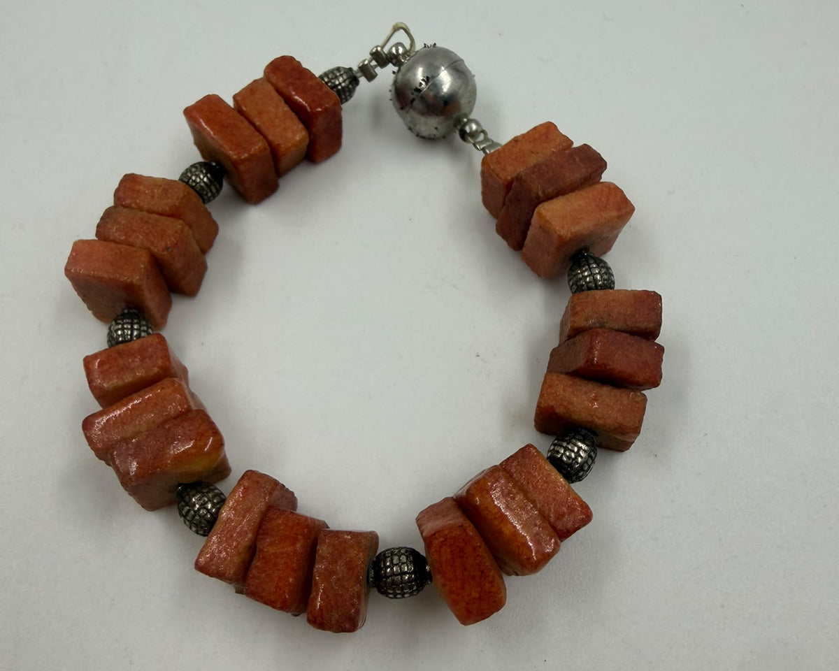 Natural coral necklace close-up of raw tablet beads - macro