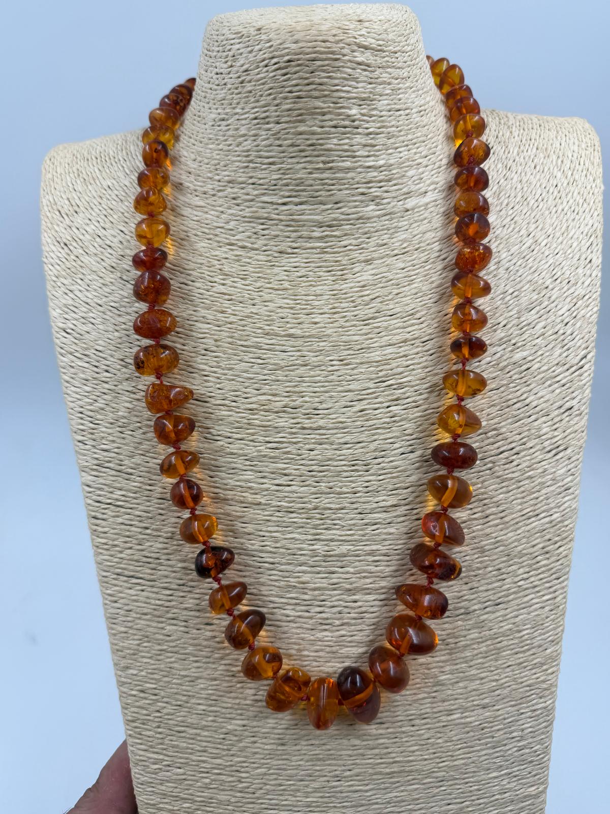 Necklace detail showing bead transparency and inclusions