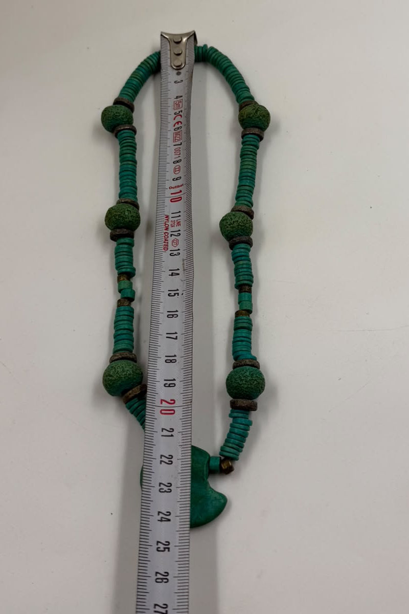 Natural turquoise heishi necklace on burlap display showing full length ~19 inches with fan pendant