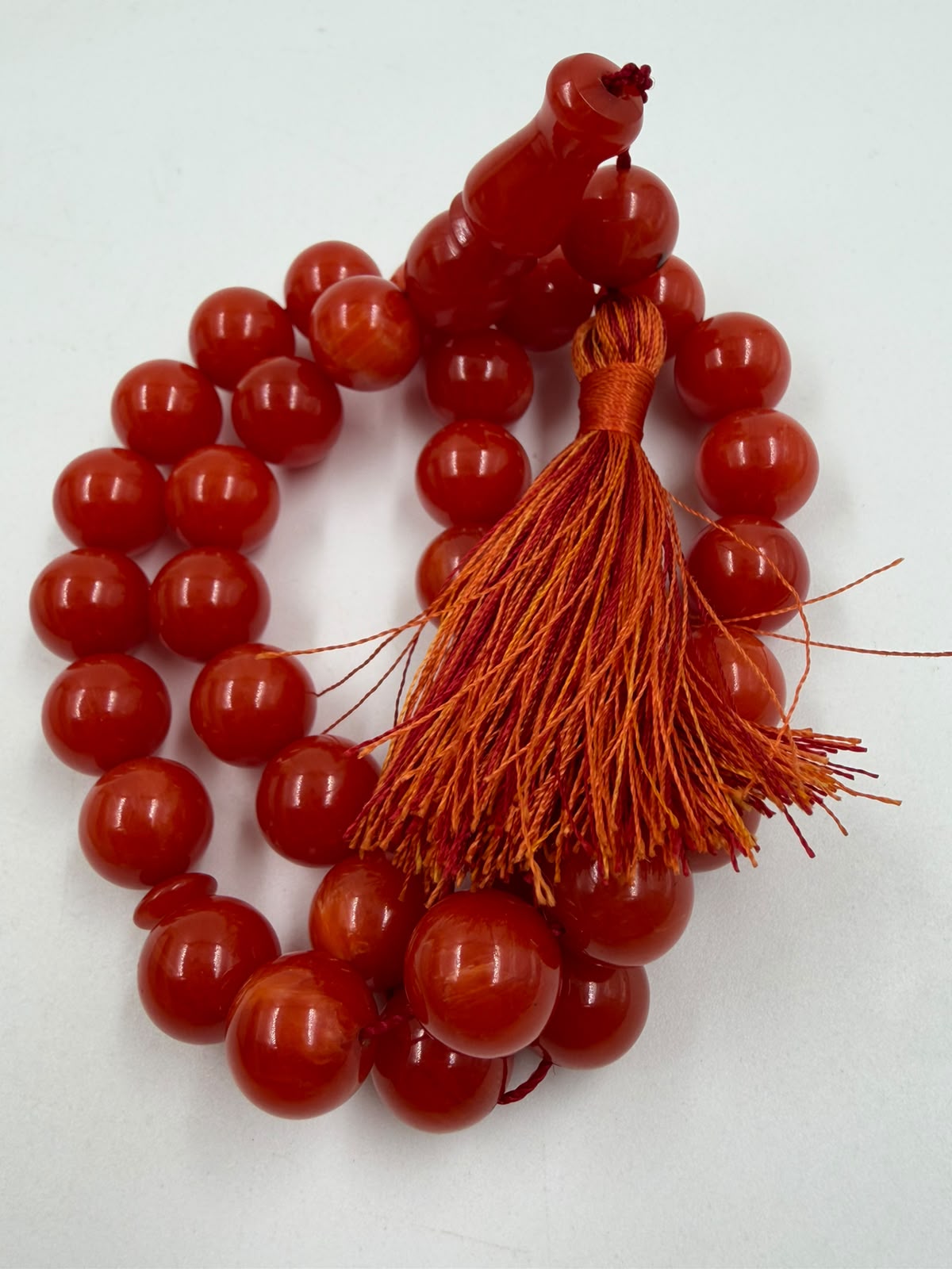 Turkish Faturan prayer beads held in hand showing size and weight of 12mm beads