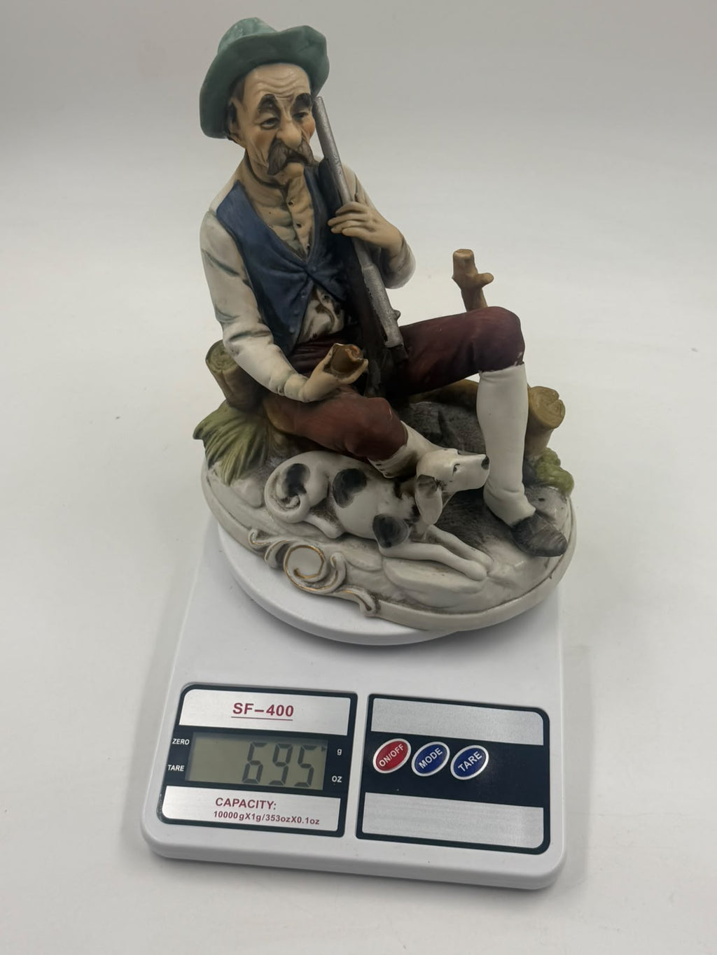 Vintage Capodimonte flute player figurine front view with scale showing 20cm height