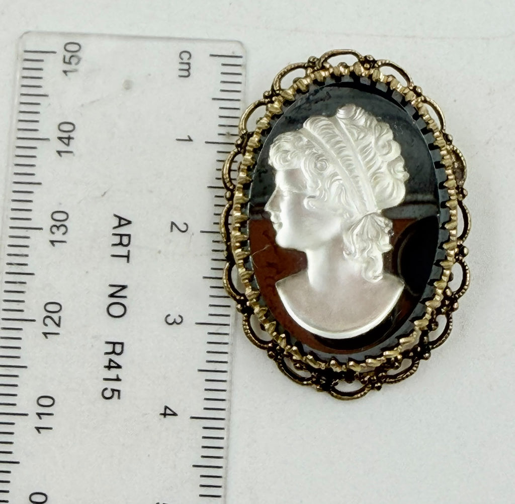 Cameo brooch with ruler showing 35x25mm size