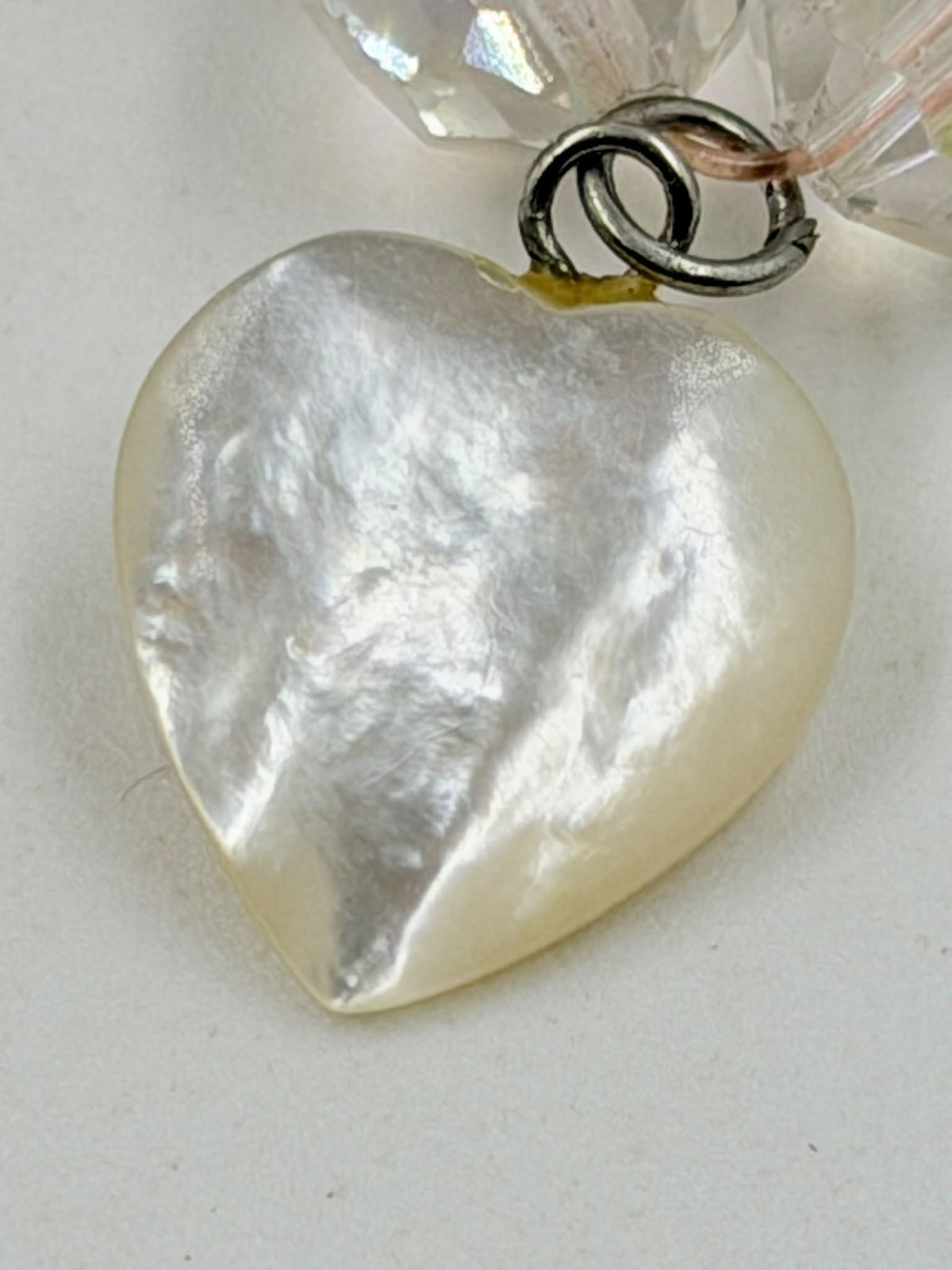 Rose quartz necklace on scale showing 110 grams weight