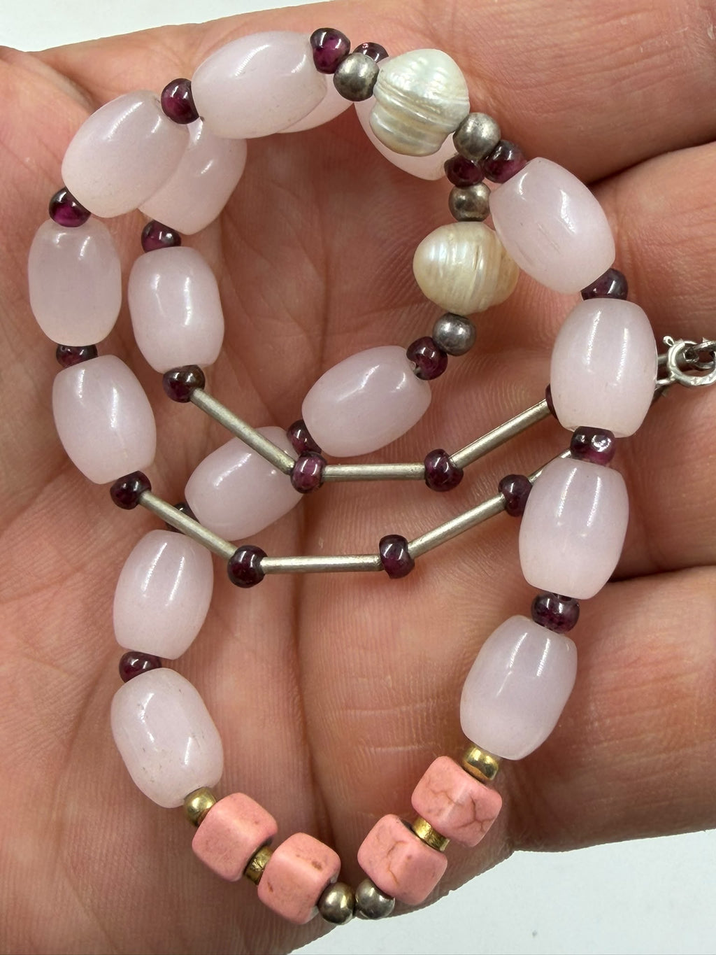 Rose quartz garnet coral pearl bracelet close-up showing natural stone texture and silver tube spacers