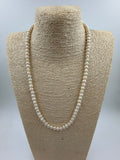Side view of freshwater pearl necklace showing bead size 5mm and lobster clasp metal finish