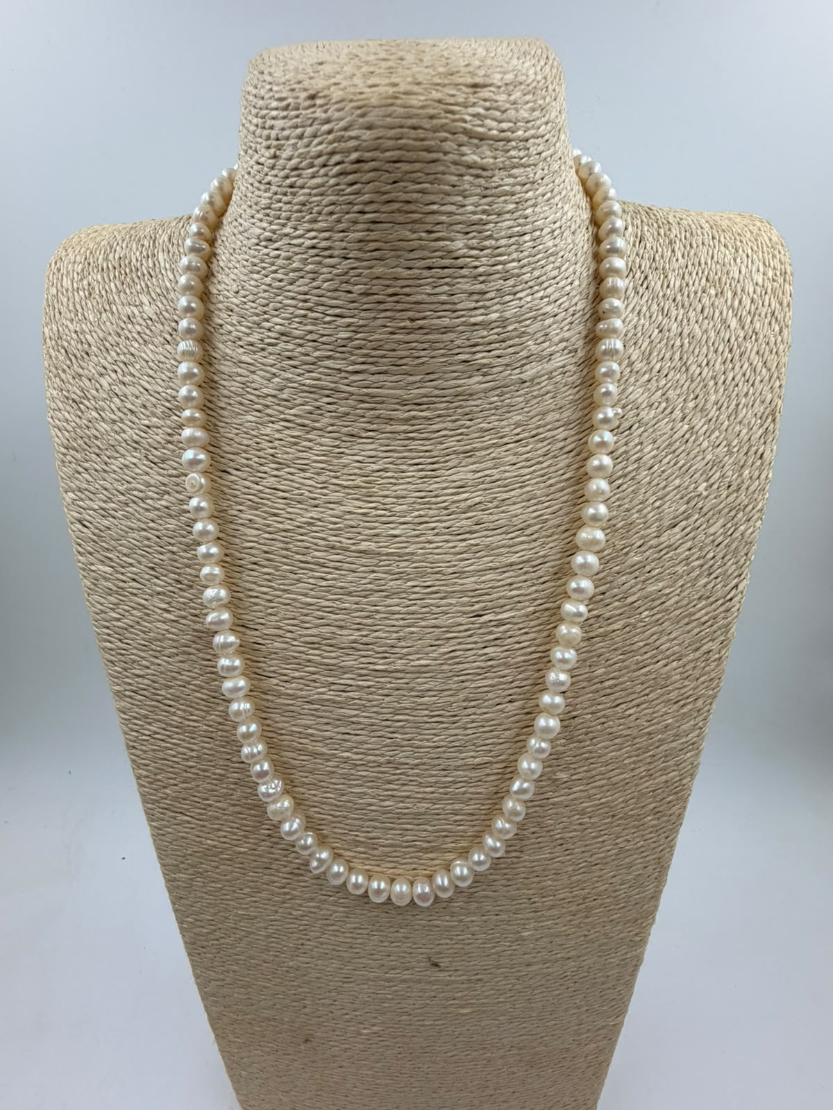 Side view of freshwater pearl necklace showing bead size 5mm and lobster clasp metal finish