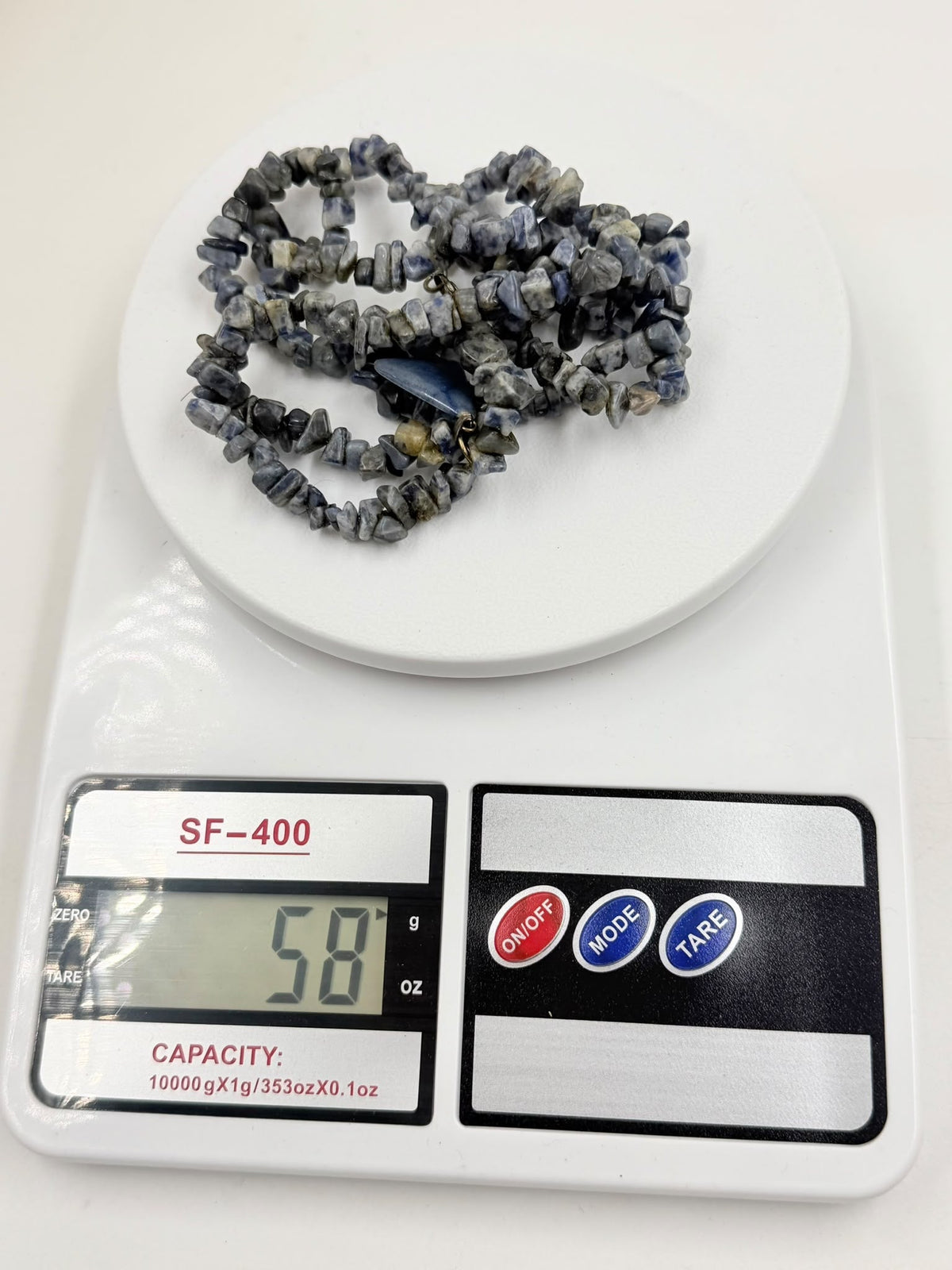 Natural sodalite chip necklace on wicker bust - full length double strand view with pendant