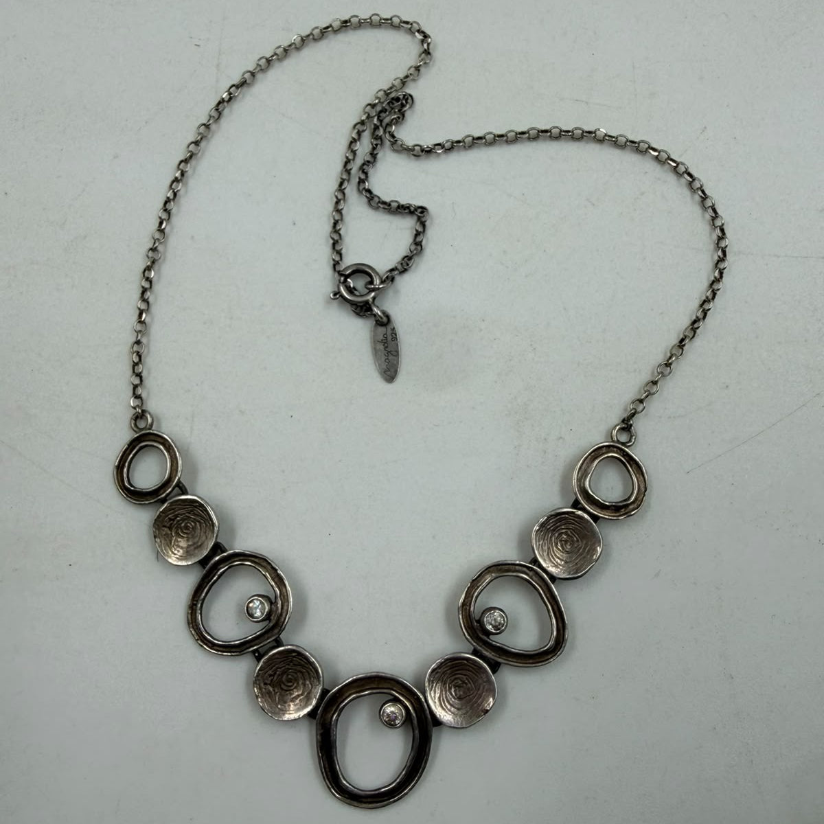 Sterling silver necklace on jewelry display bust