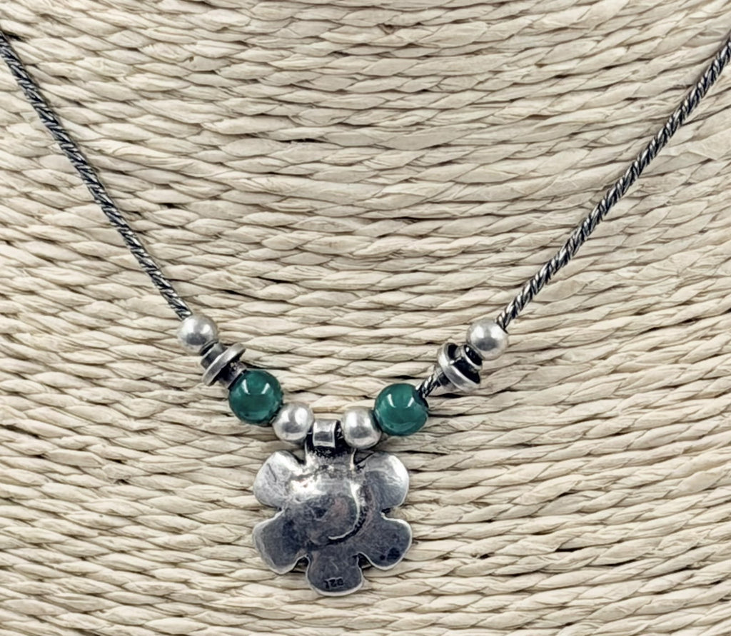 Pendant close up showing silver details